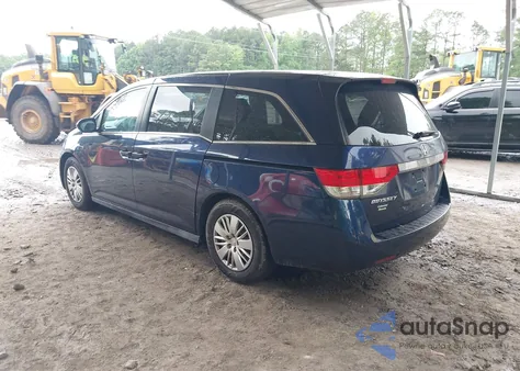 2014 Honda Odyssey Lx z USA, uszkodzony, nr VIN 5FNRL5H21EB082119